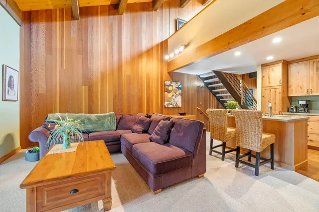 a living room with furniture and large window