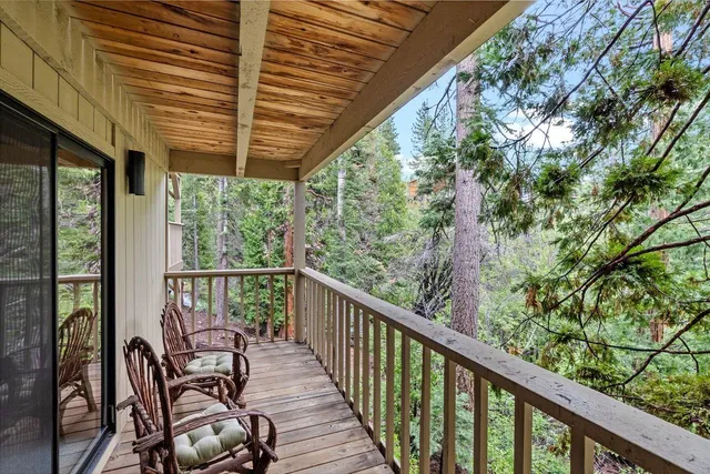 a view of balcony with furniture
