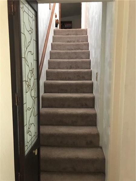 317 West Bruceton Road Pittsburgh, PA 15236 - Photo 15 of 22 Stairs from dining room lead to the second floor with 2 full sized bedrooms and one full bath.