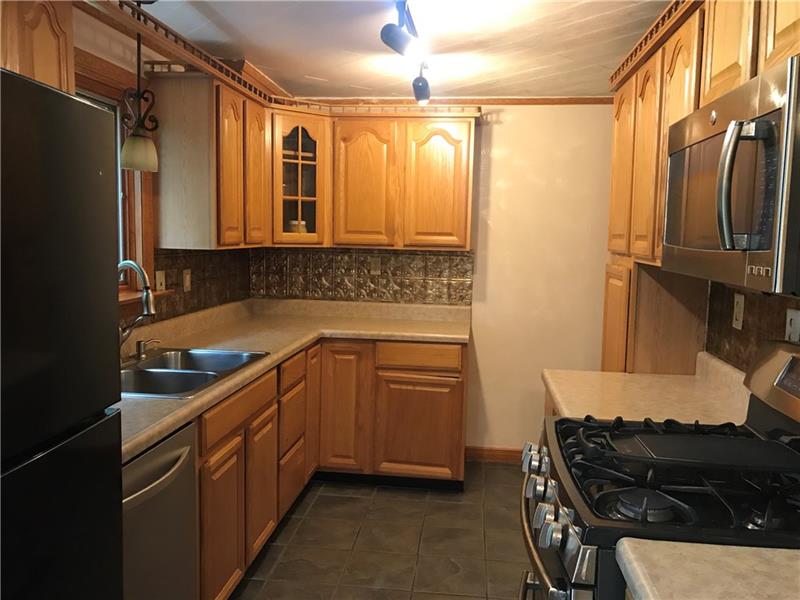 317 West Bruceton Road Pittsburgh, PA 15236 - Photo 7 of 22 Updated kitchen that gives plenty of room for food preparation.