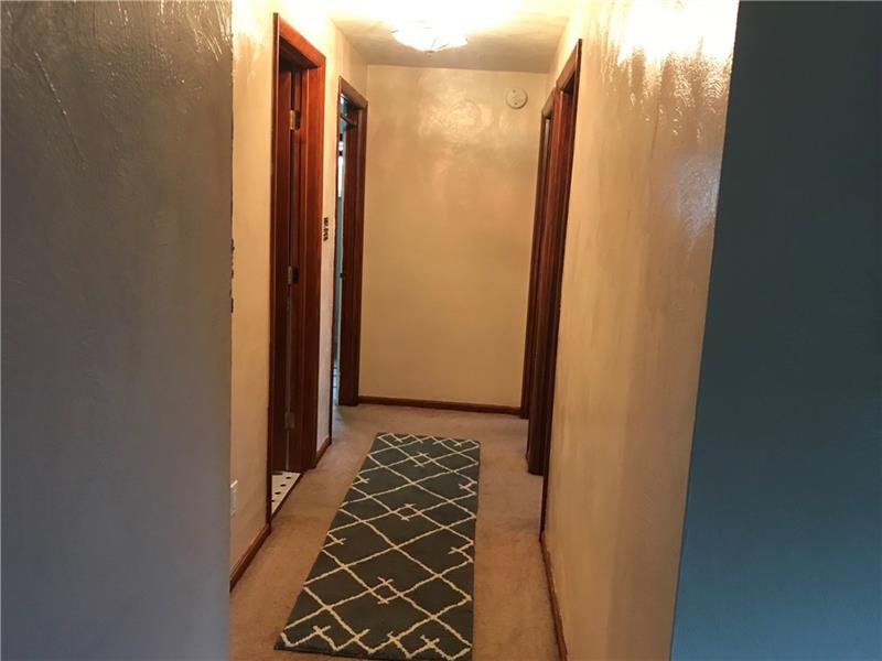 317 West Bruceton Road Pittsburgh, PA 15236 - Photo 9 of 22 Hallway on main floor leading to the 3 bedrooms and one bathroom.