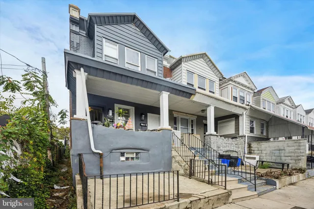 a front view of a house with glass windows