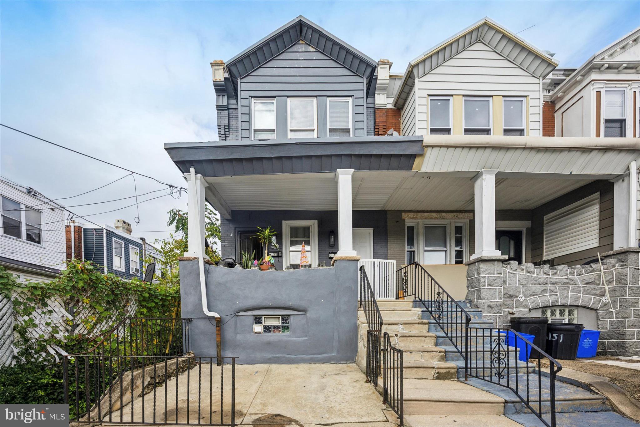 6153 Locust Street, Unit 1 Philadelphia, PA 19139 - Photo 14 of 14 a front view of house with a garden