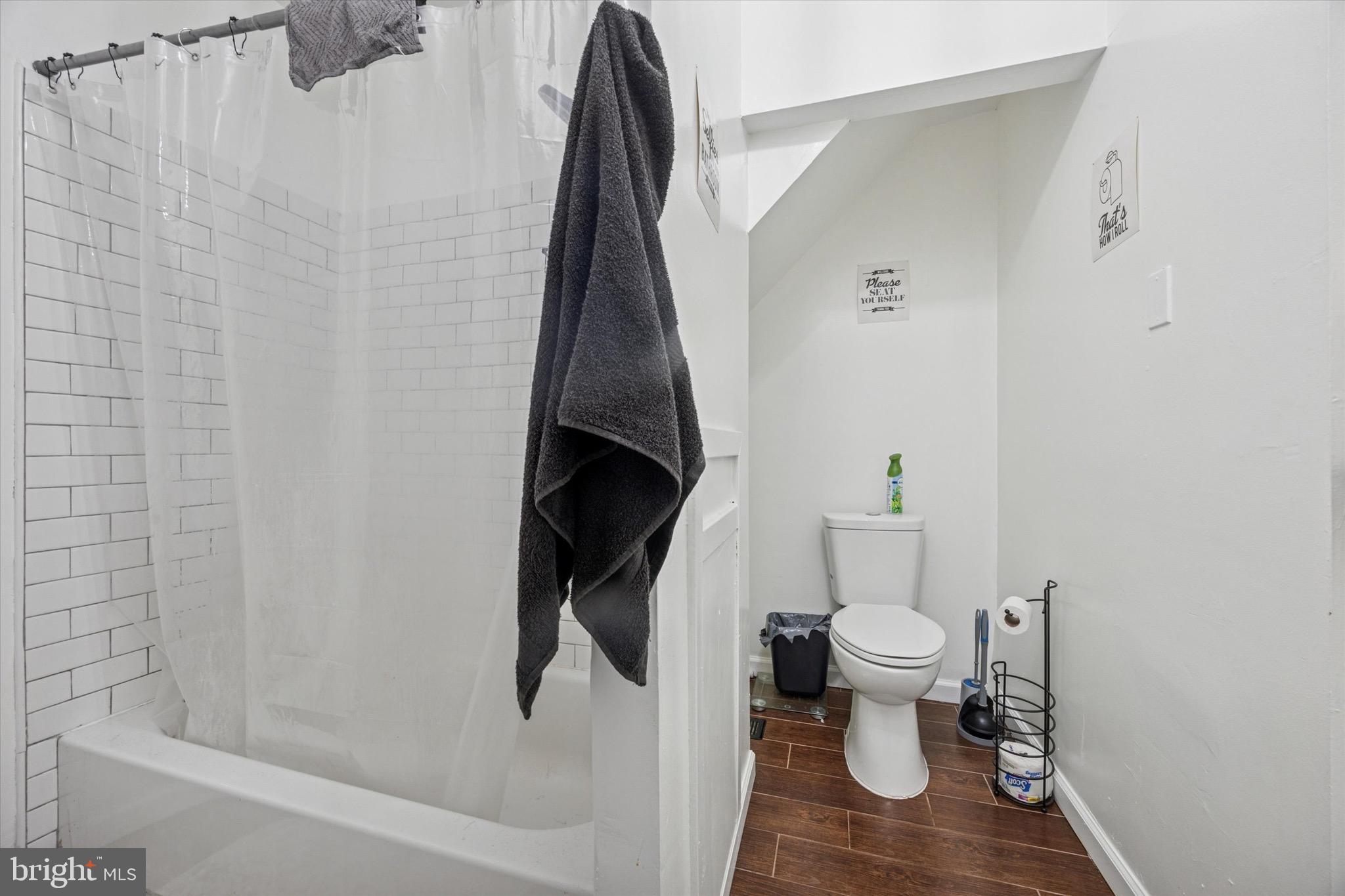 6153 Locust Street, Unit 1 Philadelphia, PA 19139 - Photo 9 of 14 a bathroom with a toilet and a shower