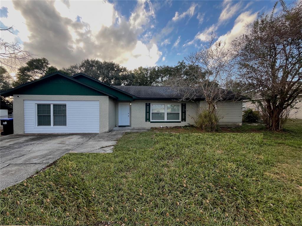 3222 Hammersmith Road Orlando, FL 32818 - Photo 1 of 29 front view of a house with a yard