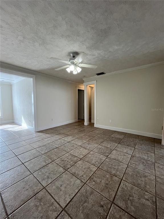 3222 Hammersmith Road Orlando, FL 32818 - Photo 11 of 29 a view of an empty room with a window