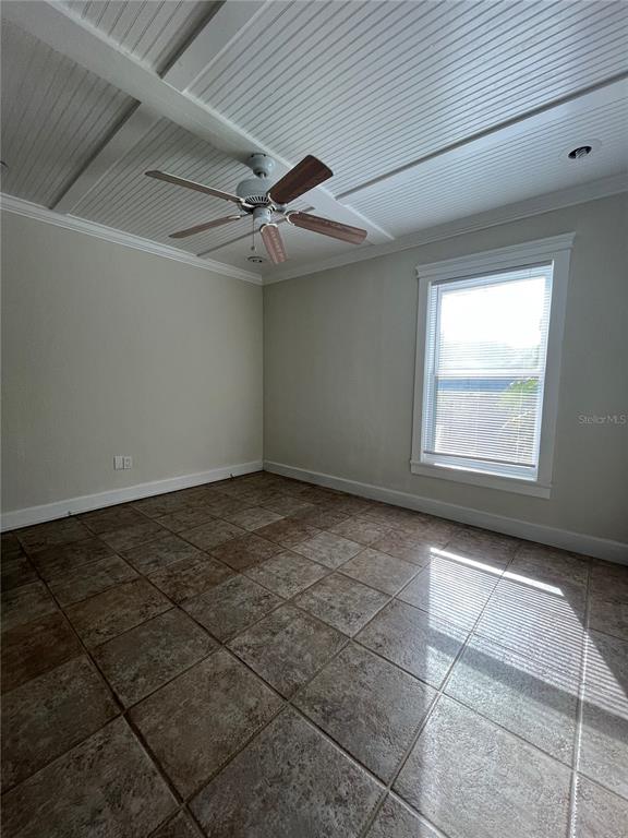 3222 Hammersmith Road Orlando, FL 32818 - Photo 12 of 29 a view of an empty room with a window