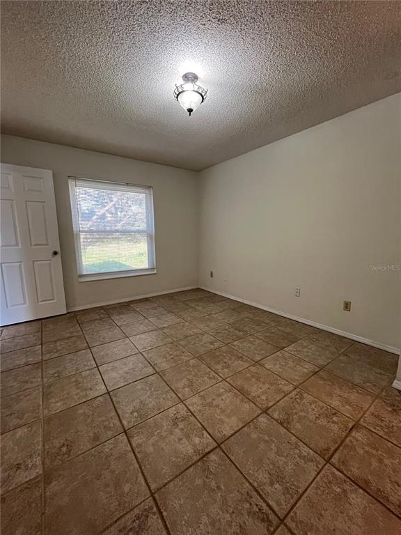 3222 Hammersmith Road Orlando, FL 32818 - Photo 18 of 29 a view of an empty room and window