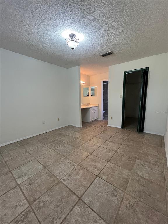 3222 Hammersmith Road Orlando, FL 32818 - Photo 19 of 29 an empty room with a bathroom