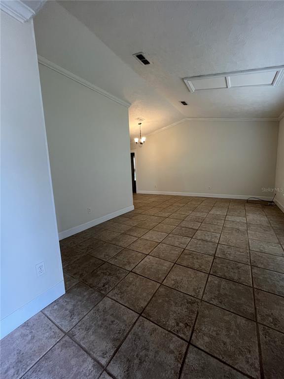 3222 Hammersmith Road Orlando, FL 32818 - Photo 2 of 29 a view of a room with an empty space and a window