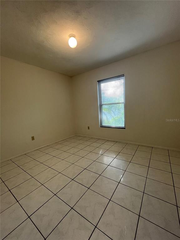 3222 Hammersmith Road Orlando, FL 32818 - Photo 21 of 29 an empty room with windows