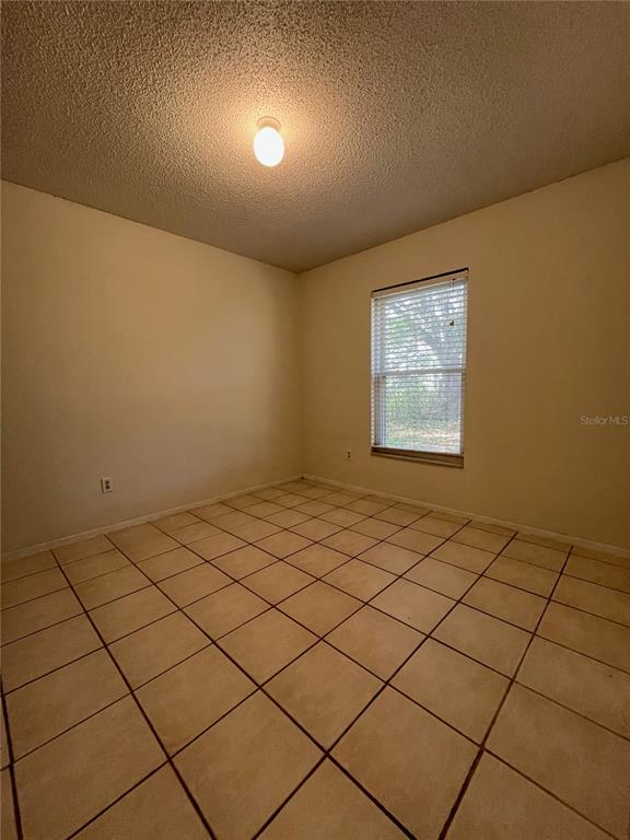 3222 Hammersmith Road Orlando, FL 32818 - Photo 22 of 29 a view of an empty room and a window