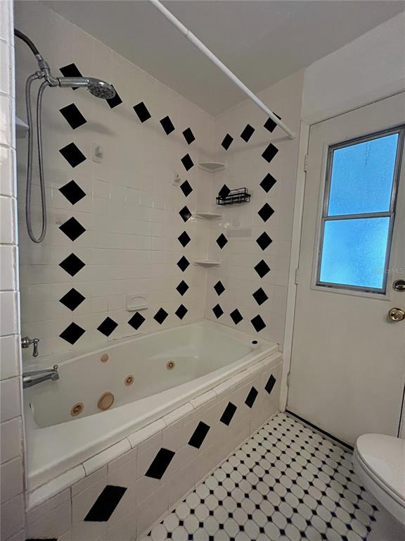 3222 Hammersmith Road Orlando, FL 32818 - Photo 27 of 29 a white bath tub sitting in a bathroom