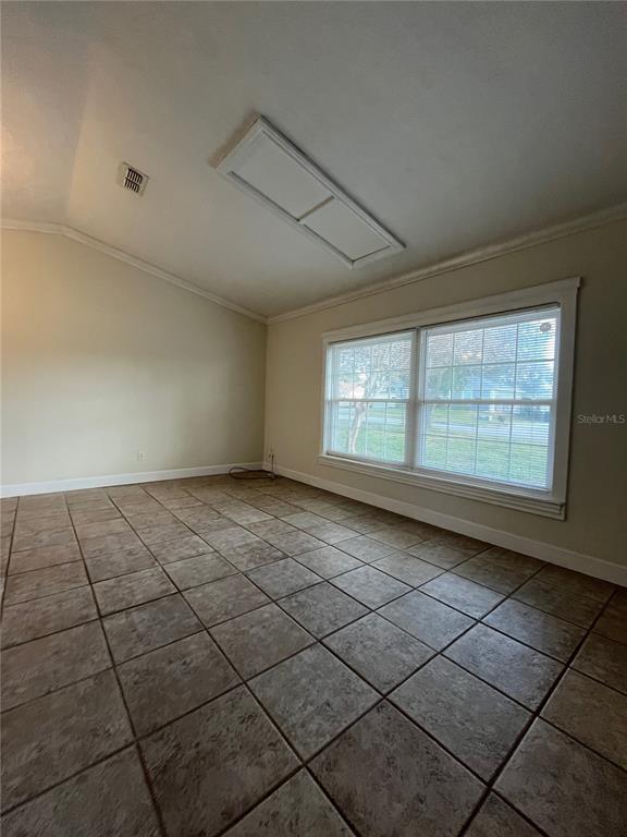 3222 Hammersmith Road Orlando, FL 32818 - Photo 3 of 29 a view of an empty room and window