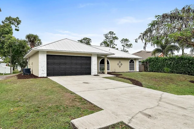 a front view of a house with yard