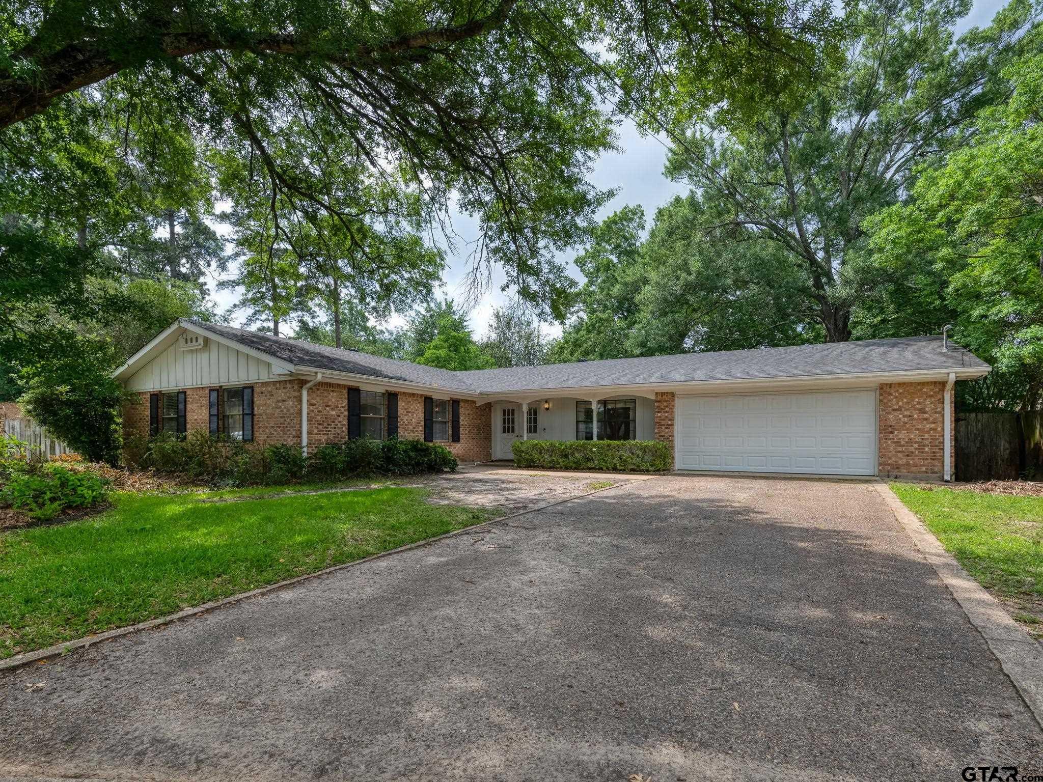 a front view of a house with yard