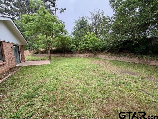 2513 Merry Lane Tyler, TX 75701 - Photo 23 of 26 a view of a backyard with large trees