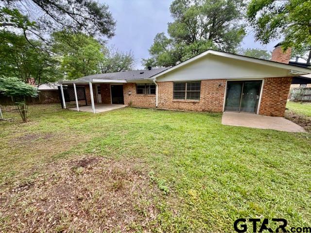 2513 Merry Lane Tyler, TX 75701 - Photo 26 of 26 a front view of a house with a garden
