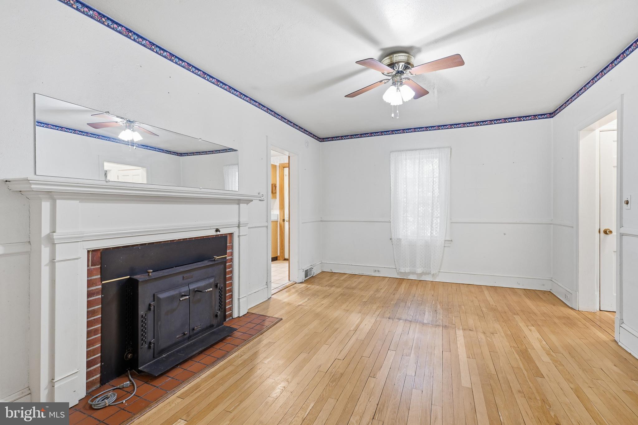 25145 Holly Road Seaford, DE 19973 - Photo 6 of 41 Living room with french doors and fireplace