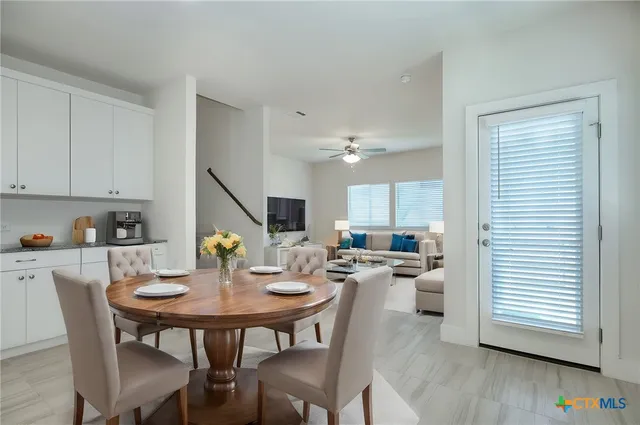 a view of a dining room with furniture and wooden floor