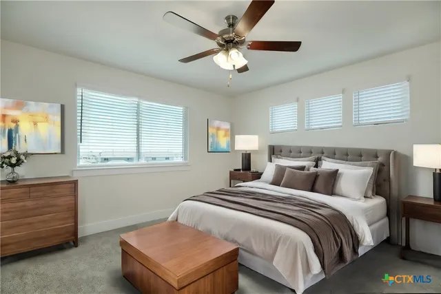 a bedroom with bed and window