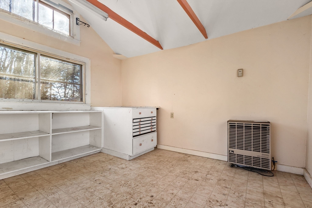 28 Birch Road Natick, MA 01760 - Photo 16 of 19 a room with a baby crib and a window