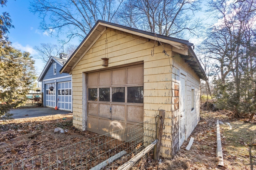 28 Birch Road Natick, MA 01760 - Photo 18 of 19 a front view of a house with a yard and garage