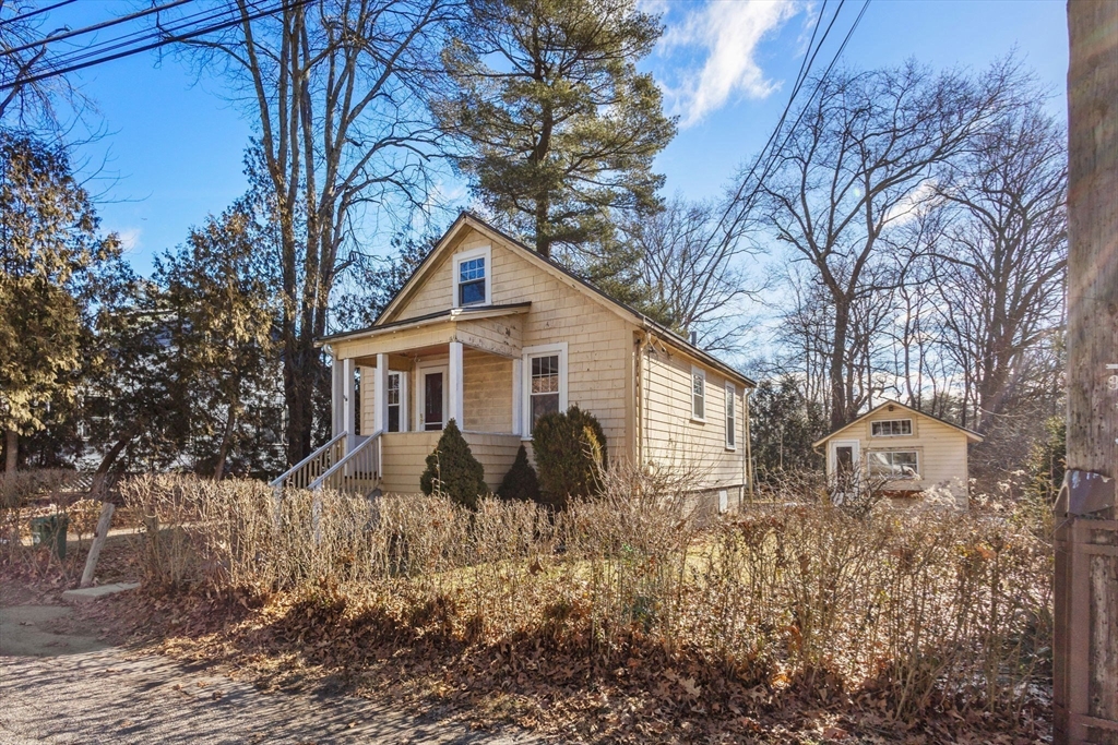 28 Birch Road Natick, MA 01760 - Photo 2 of 19 a front view of house with yard and trees around