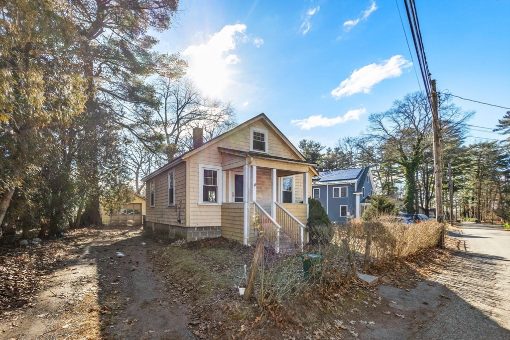 28 Birch Road Natick, MA 01760 - Photo 3 of 19 a front view of a house with a yard
