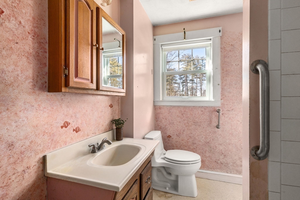 28 Birch Road Natick, MA 01760 - Photo 6 of 19 a bathroom with a sink a toilet and a window
