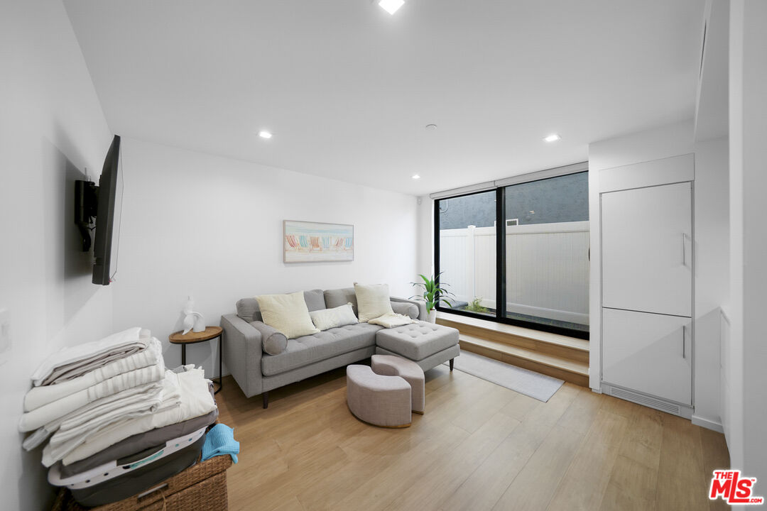 1500 Ocean Drive Oxnard, CA 93035 - Photo 12 of 75 a living room with furniture and a flat screen tv