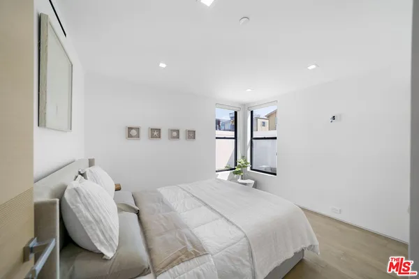 a view of a balcony with furniture and floor to ceiling window