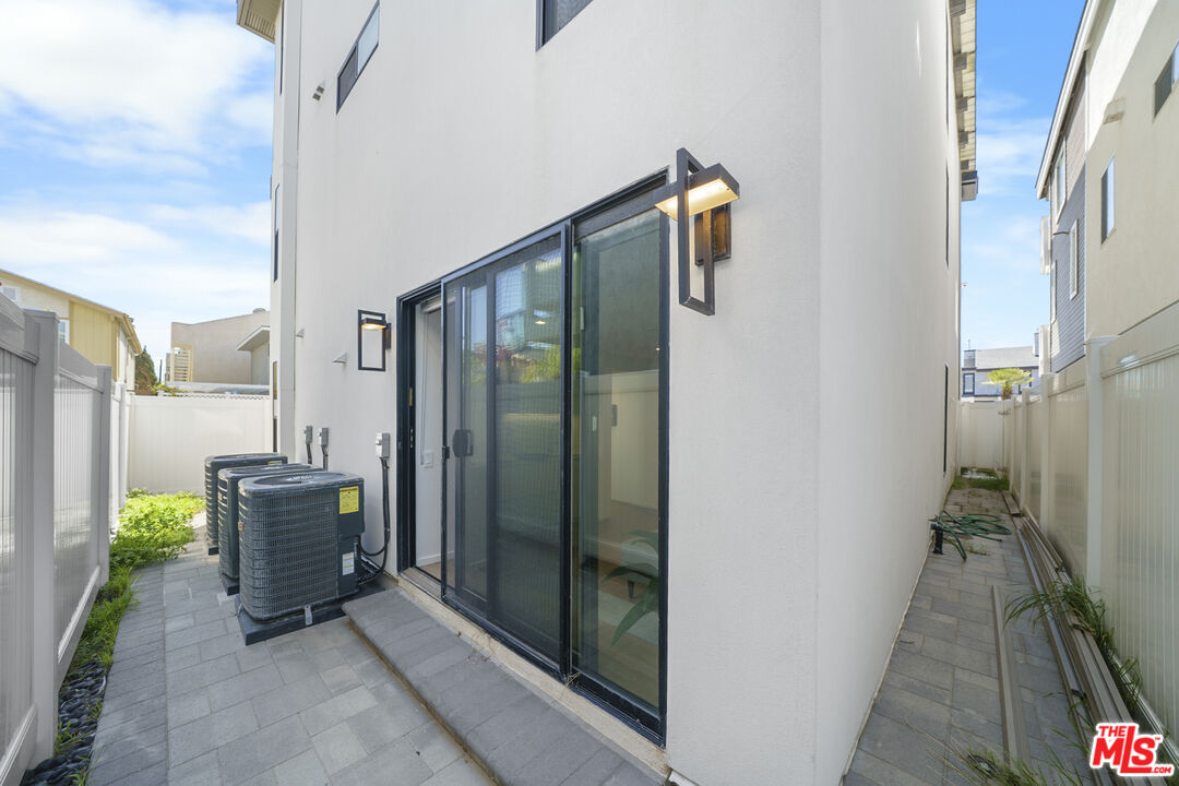 1500 Ocean Drive Oxnard, CA 93035 - Photo 19 of 75 a view of a balcony with furniture and floor to ceiling window