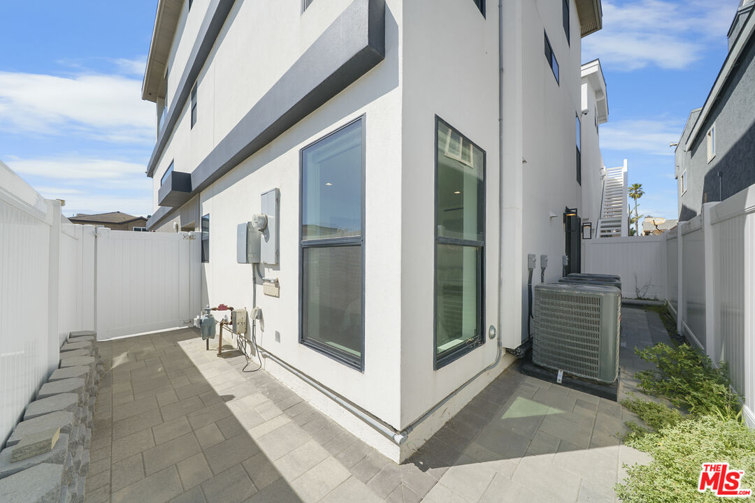 1500 Ocean Drive Oxnard, CA 93035 - Photo 20 of 75 a view of a porch with a table and chairs and potted plants