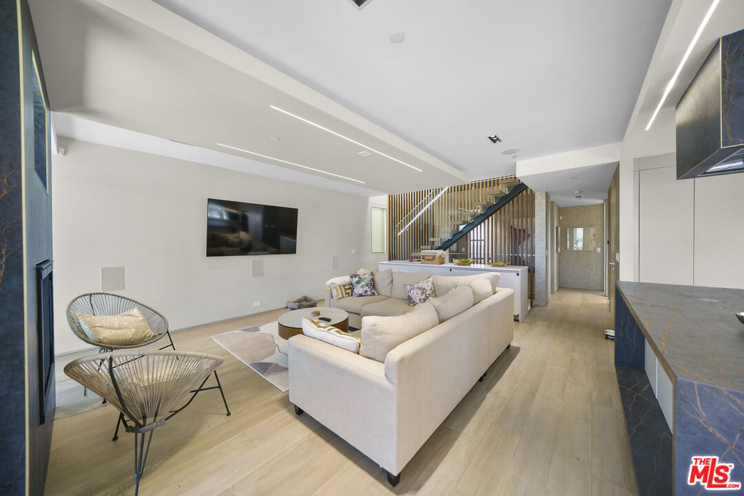 1500 Ocean Drive Oxnard, CA 93035 - Photo 22 of 75 a living room with furniture and a flat screen tv