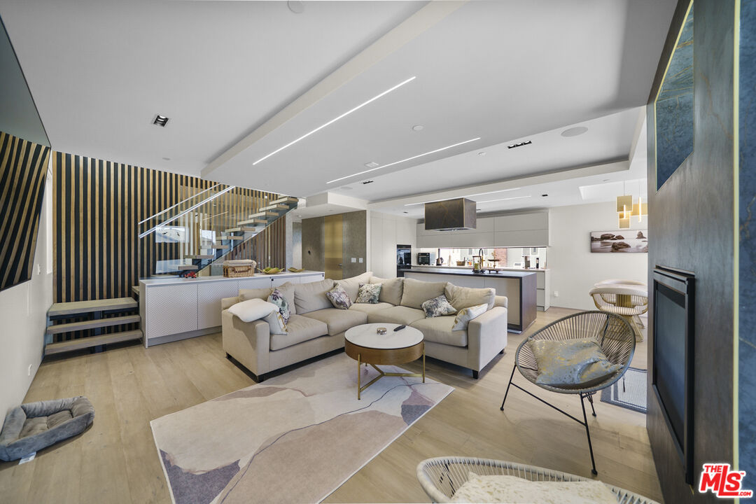 1500 Ocean Drive Oxnard, CA 93035 - Photo 23 of 75 a living room with furniture a rug and a chandelier