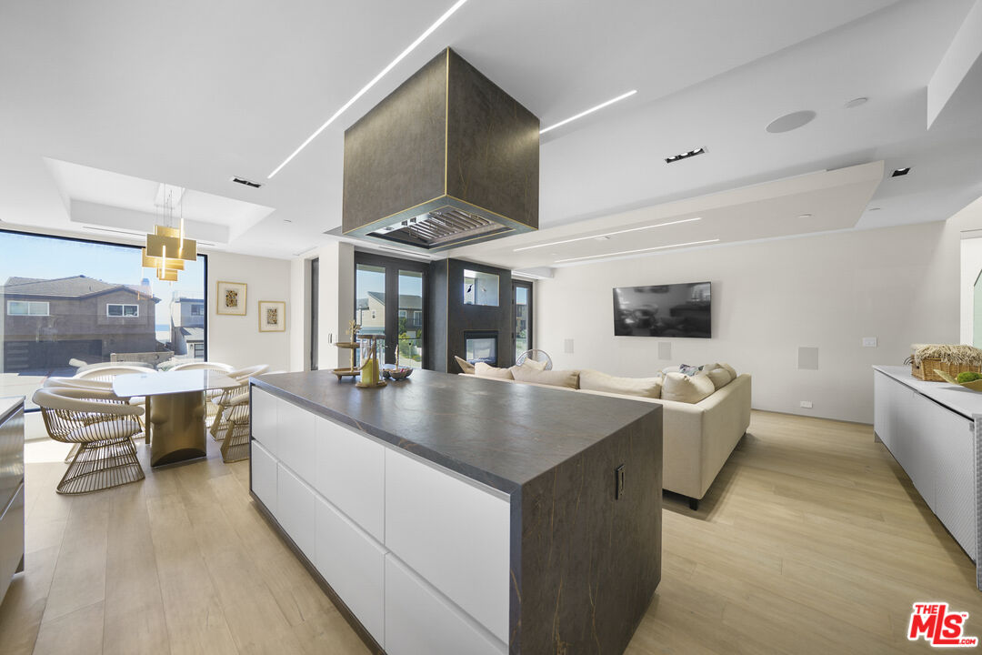 1500 Ocean Drive Oxnard, CA 93035 - Photo 27 of 75 a living room with stainless steel appliances kitchen island granite countertop a sink and a large window