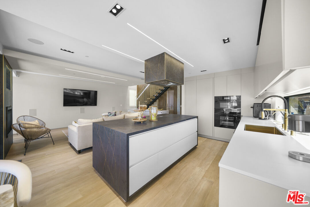 1500 Ocean Drive Oxnard, CA 93035 - Photo 28 of 75 a living room with furniture and a flat screen tv