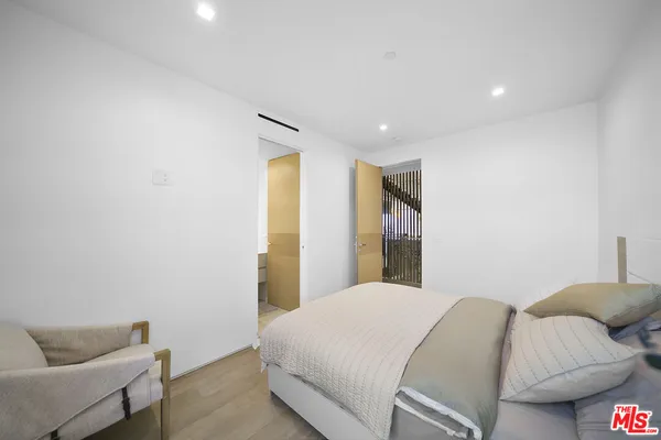 a large spacious bathroom with a large tub and shower