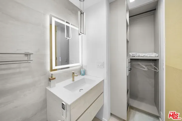 a large bathroom with a large tub and sink