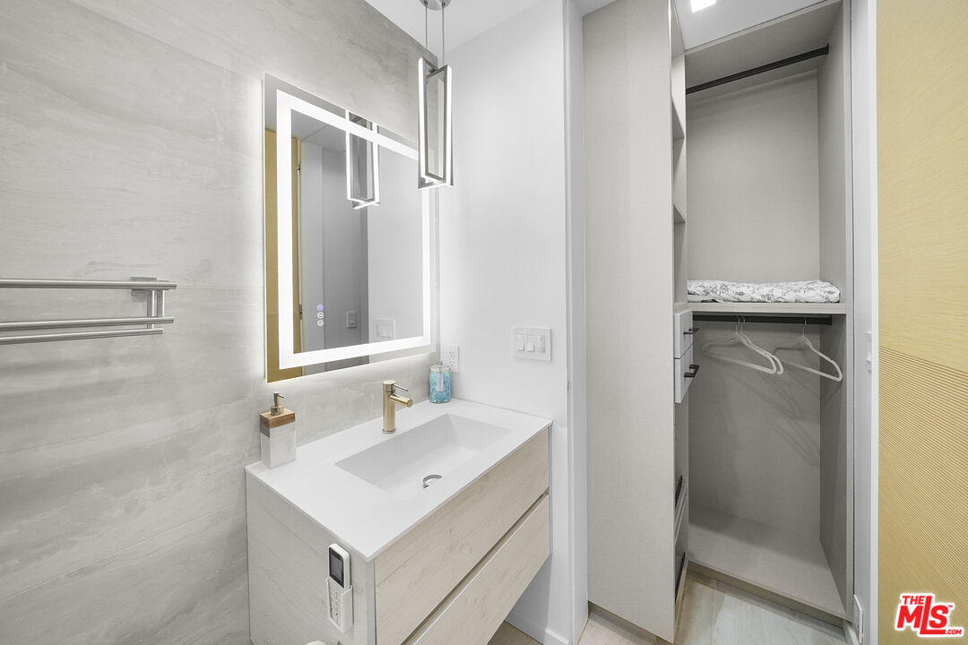 1500 Ocean Drive Oxnard, CA 93035 - Photo 41 of 75 a bathroom with a sink mirror and shower