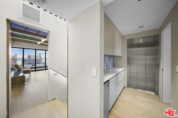 a bathroom with a glass shower door and a bathtub
