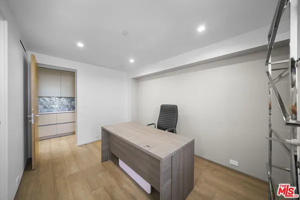a view of an empty room with a balcony