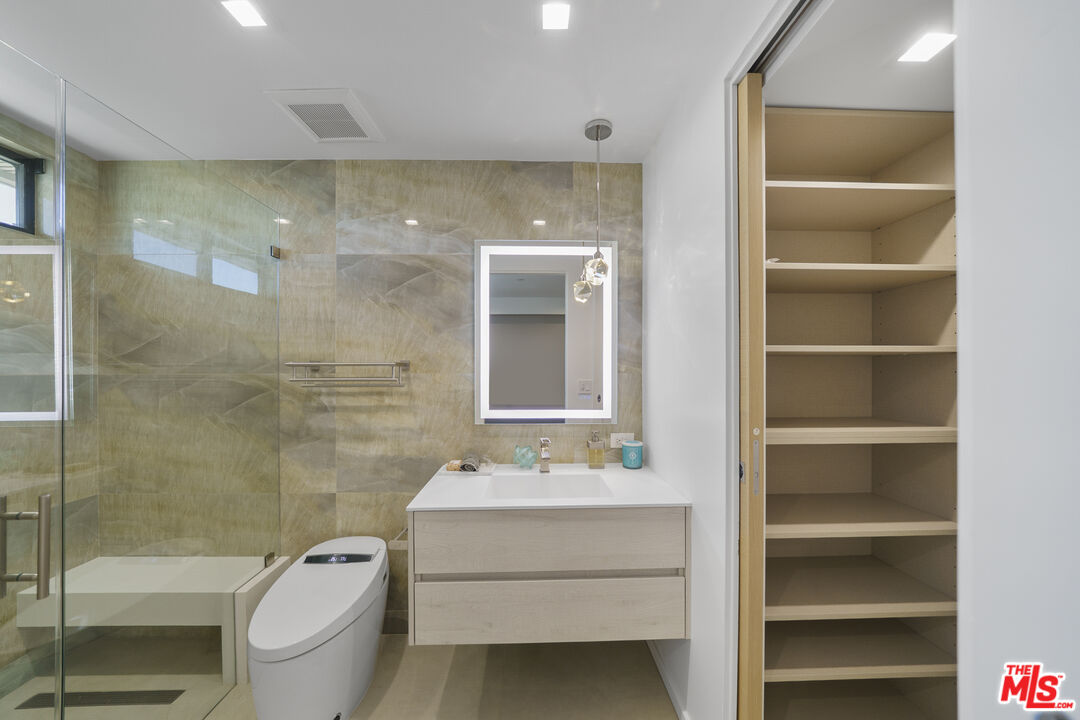 1500 Ocean Drive Oxnard, CA 93035 - Photo 47 of 75 a bathroom with a sink a toilet and shower