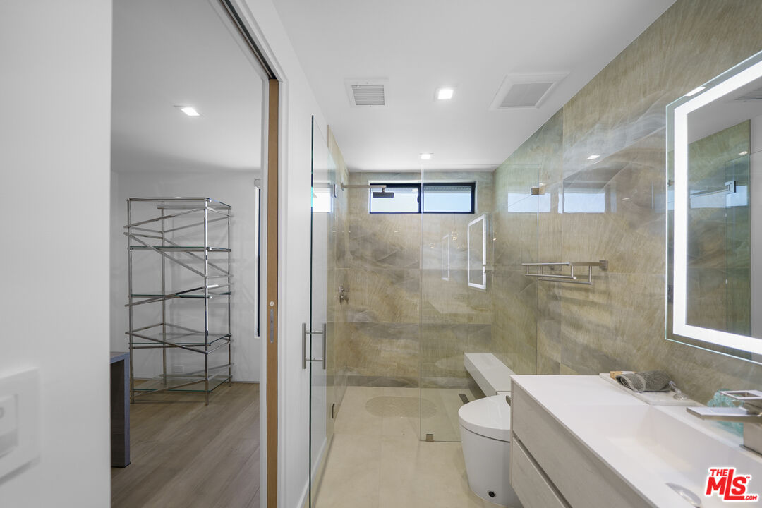 1500 Ocean Drive Oxnard, CA 93035 - Photo 49 of 75 a bathroom with a sink a toilet and shower