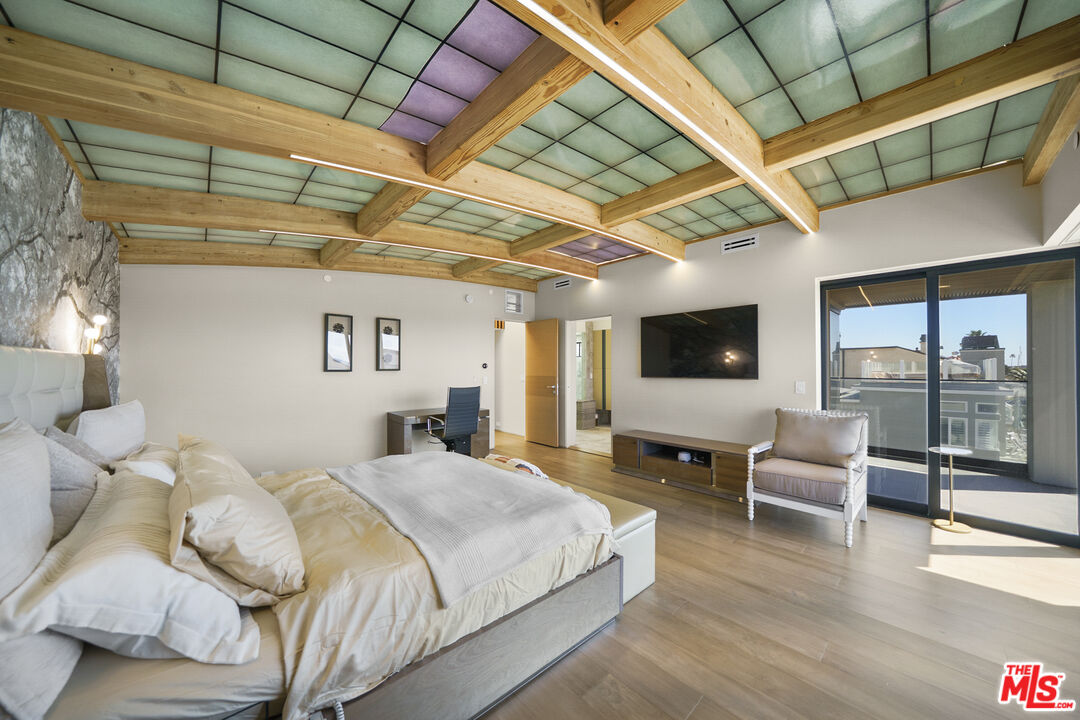 1500 Ocean Drive Oxnard, CA 93035 - Photo 52 of 75 a spacious bedroom with a bed and wooden floor