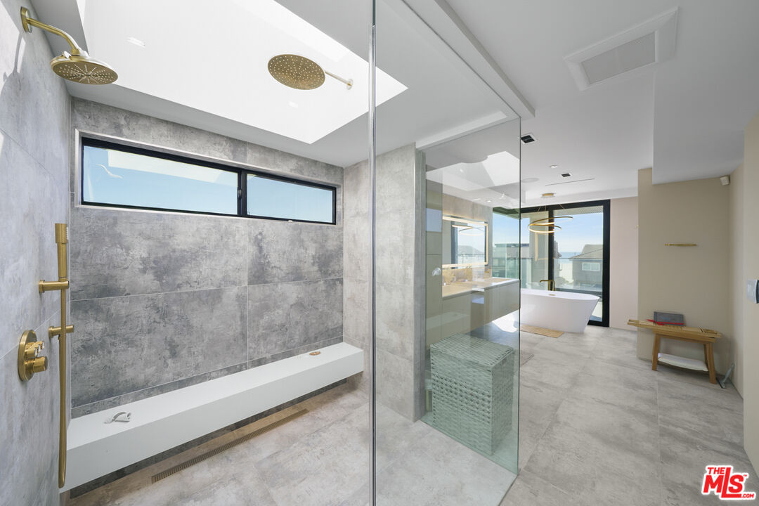 1500 Ocean Drive Oxnard, CA 93035 - Photo 63 of 75 a bathroom with a glass shower door and a bathtub