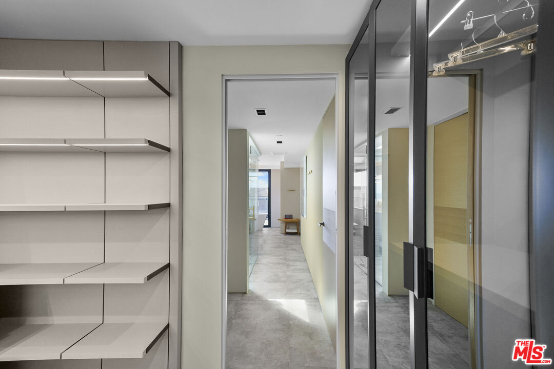 1500 Ocean Drive Oxnard, CA 93035 - Photo 67 of 75 a view of a hallway with wooden shelves