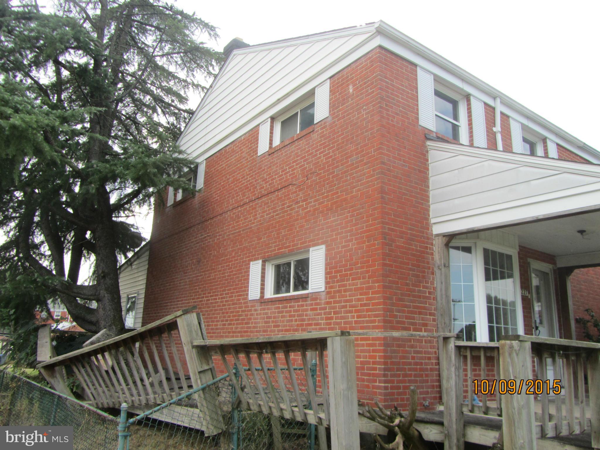 3227 Vulcan Road Baltimore, MD 21222 - Photo 2 of 17 a front view of a house with iron fence