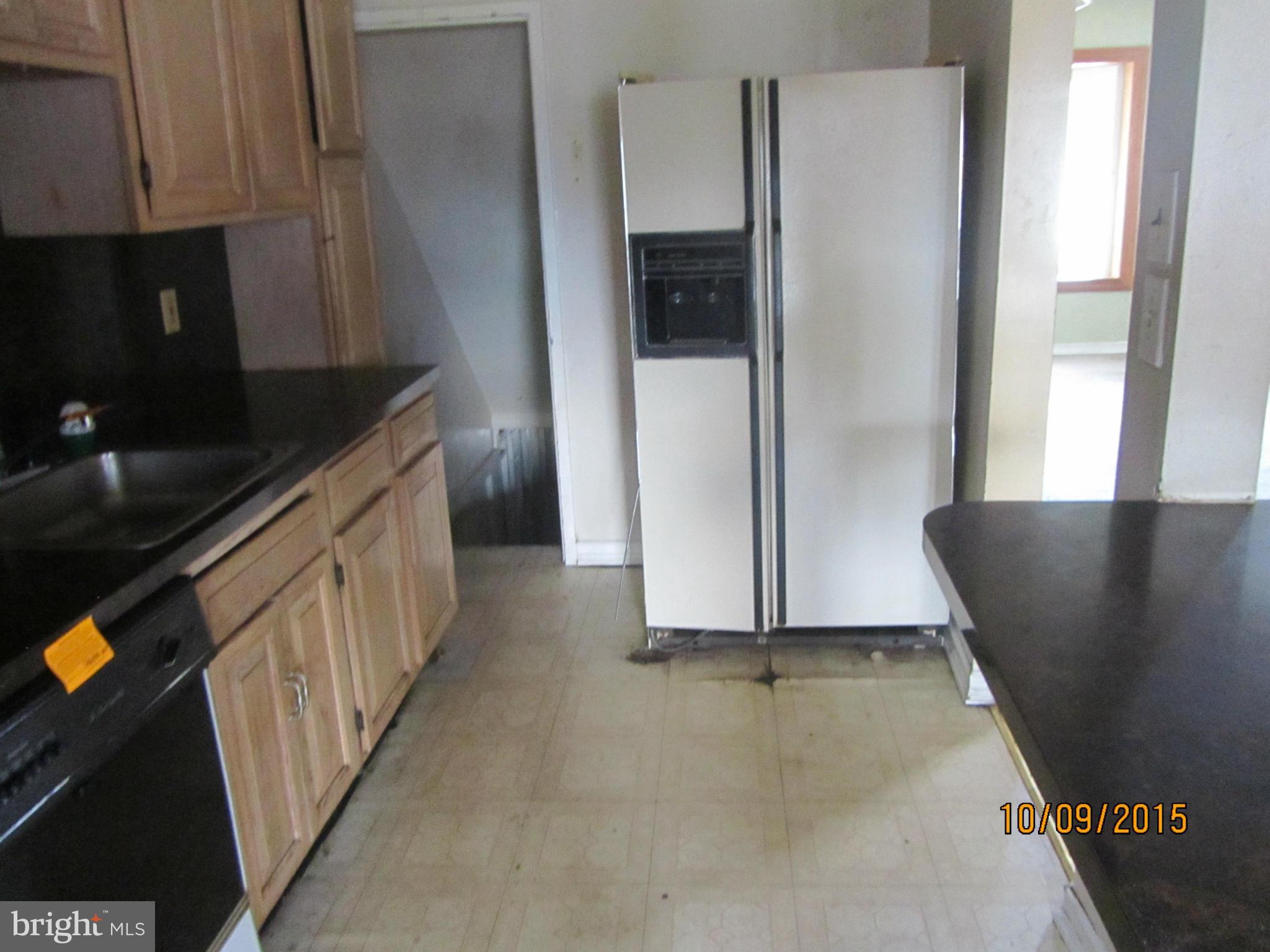 3227 Vulcan Road Baltimore, MD 21222 - Photo 11 of 17 a kitchen with stainless steel appliances granite countertop a refrigerator and a sink